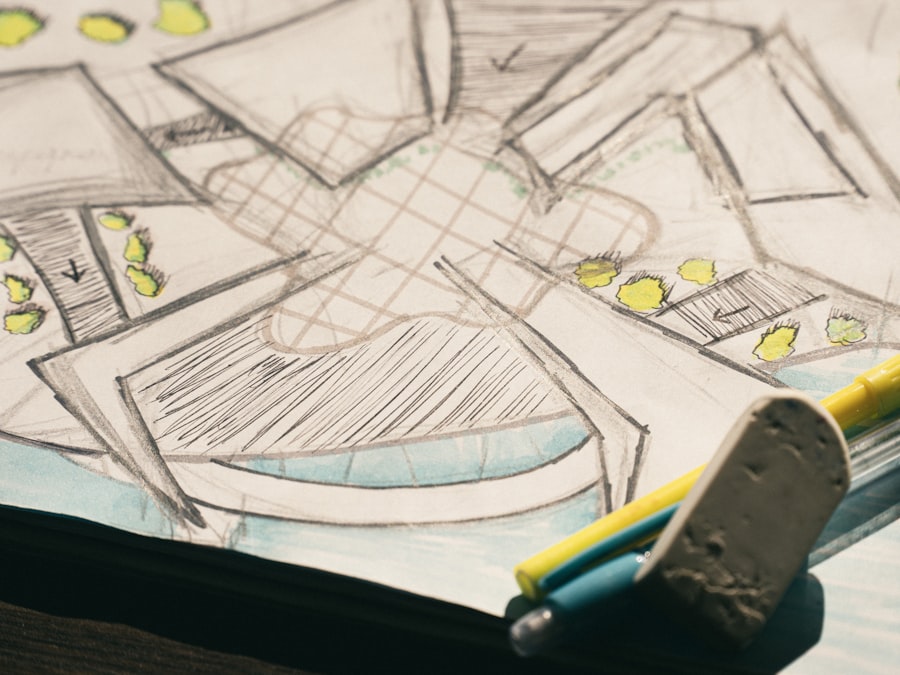 A pencil sketch of a building floor plan with yellow markers and an eraser