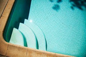 steps in corner of pool- TurnKey Pool Builders