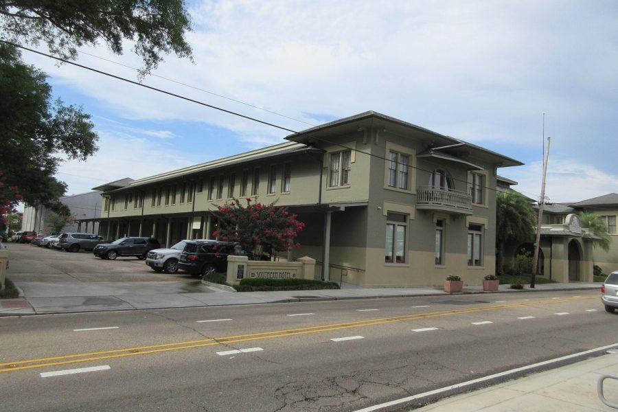 The Southern Hotel in Covington, a two-storey building with deep balconies, seen from across the street