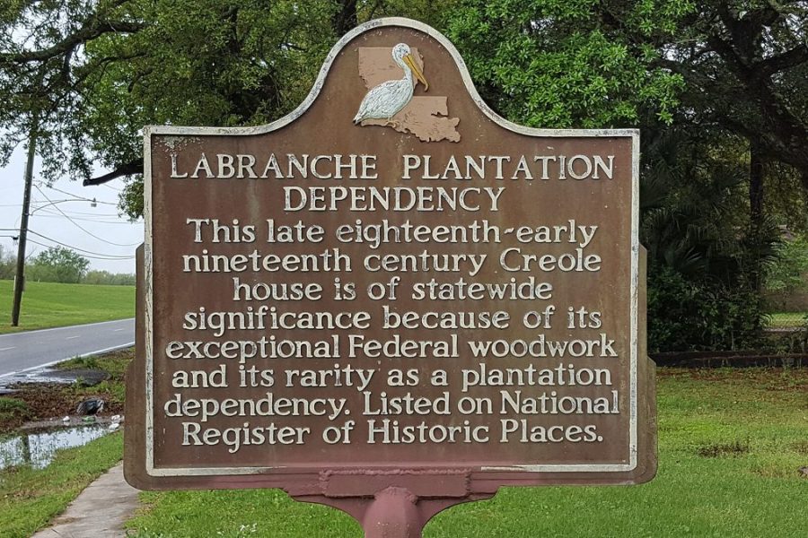 The historical marker for the LaBranche Plantation Dependency at St. Rose, under live oaks